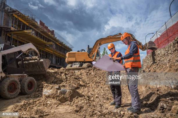 Engineers checking project status